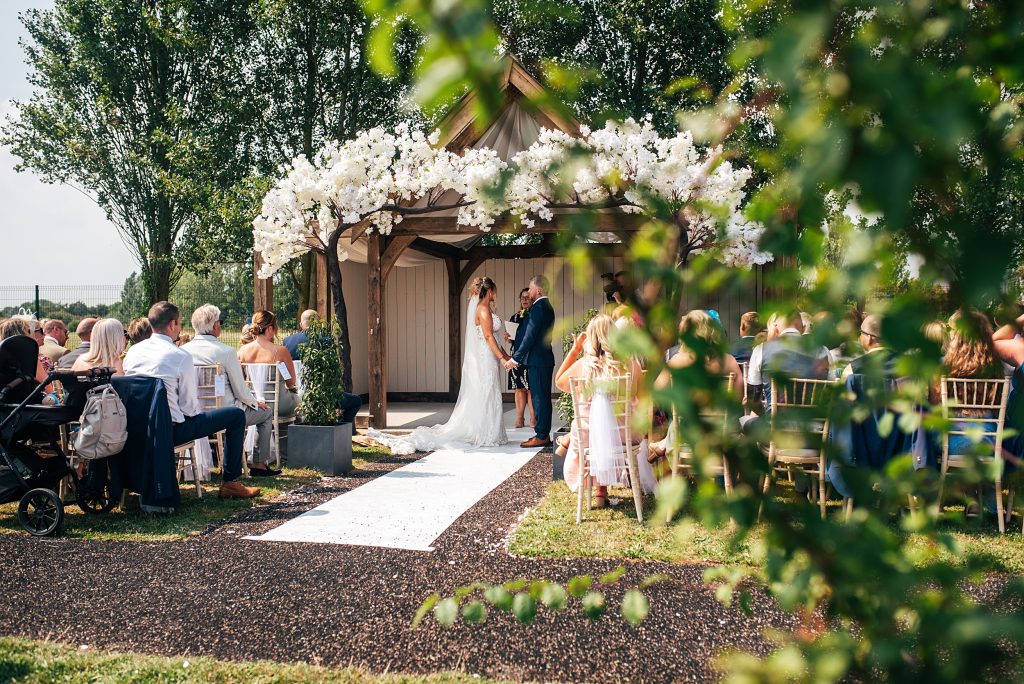 view of outdoor wedding ceremony from behind