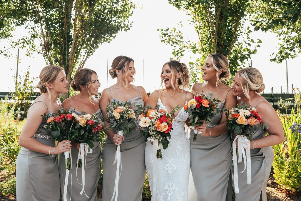 bride with laughing bridesmaids