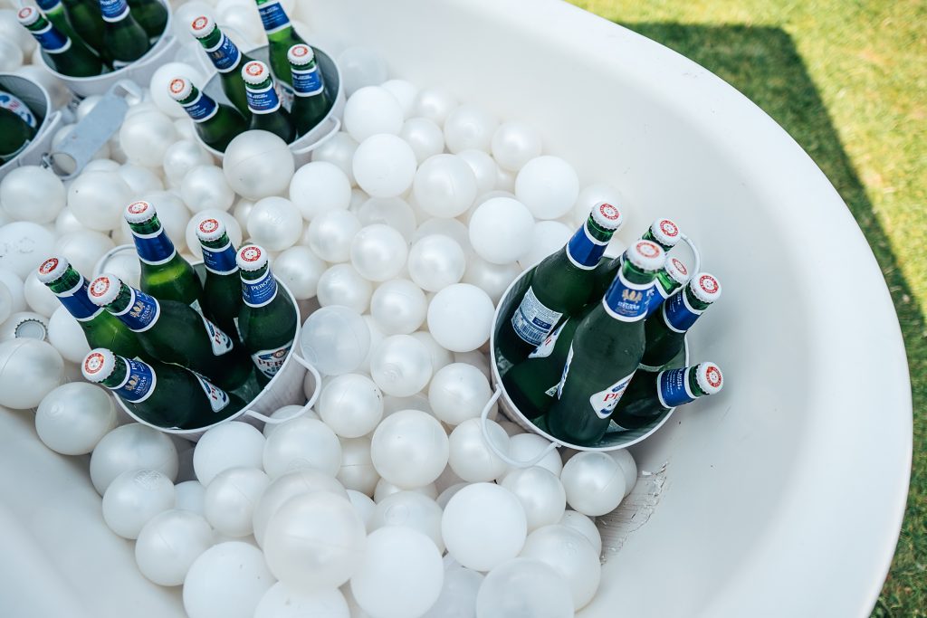 bottles of beer kept cold in ice bath
