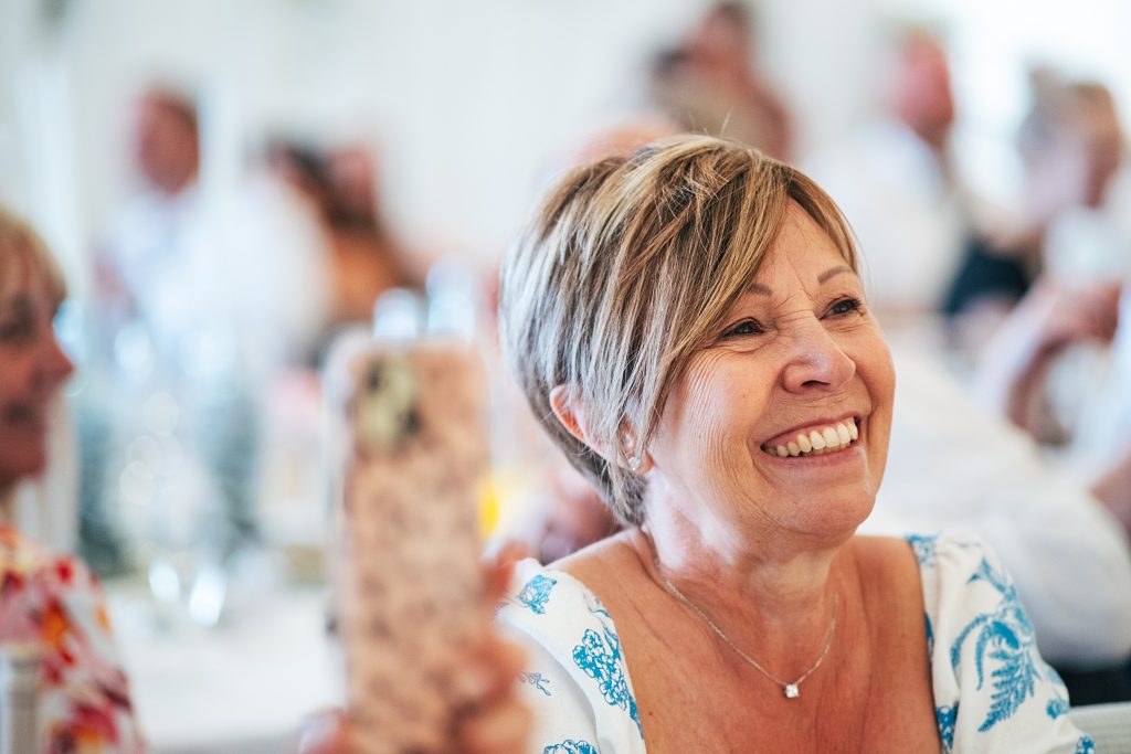 guest smiles during speech