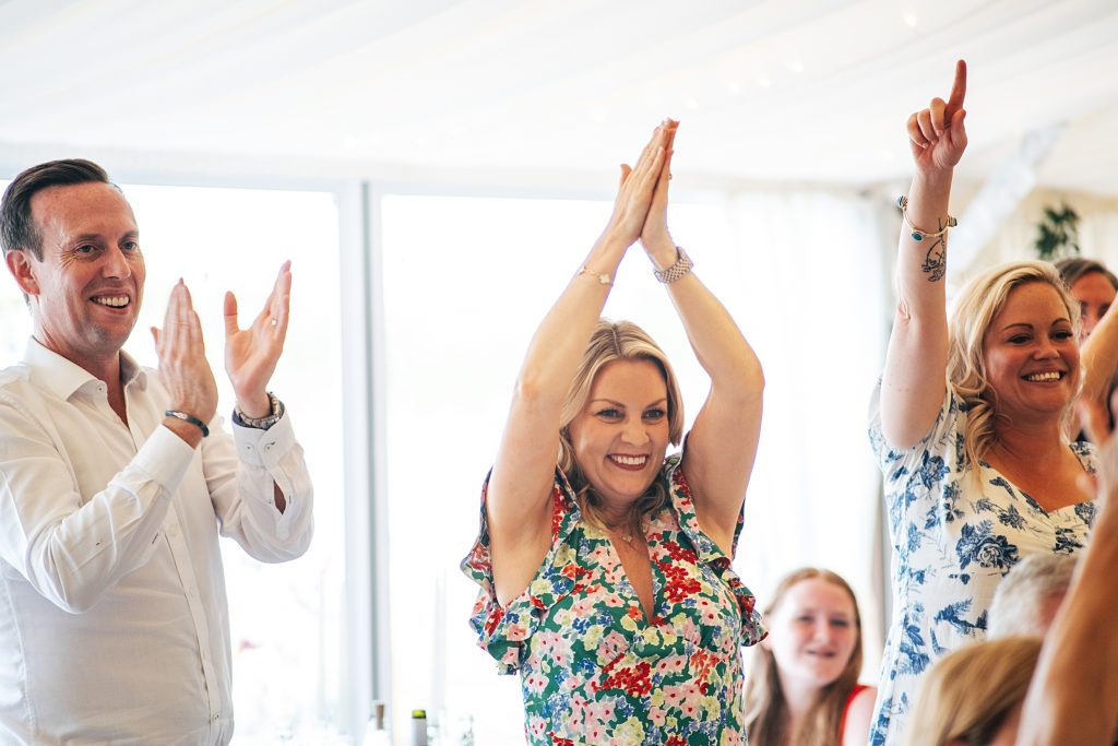 guests clap during speeches